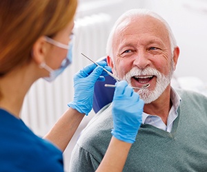 Man smiles at dentist?