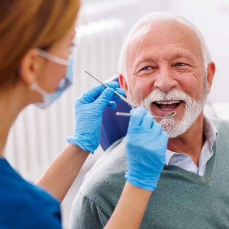 Senior man in dental chair