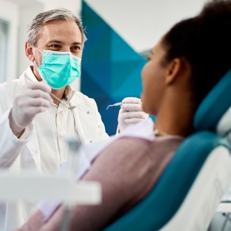 Dentist about to give a patient a preventive dental checkup