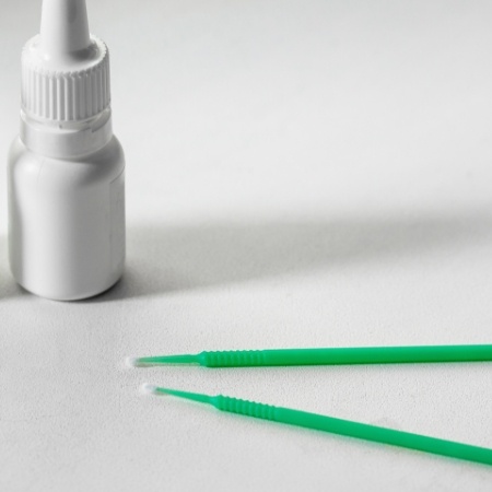 Two long thin dental instruments on table