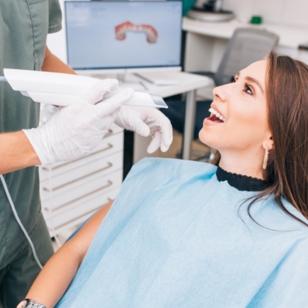 Dentist about to take digital dental impressions of a patient